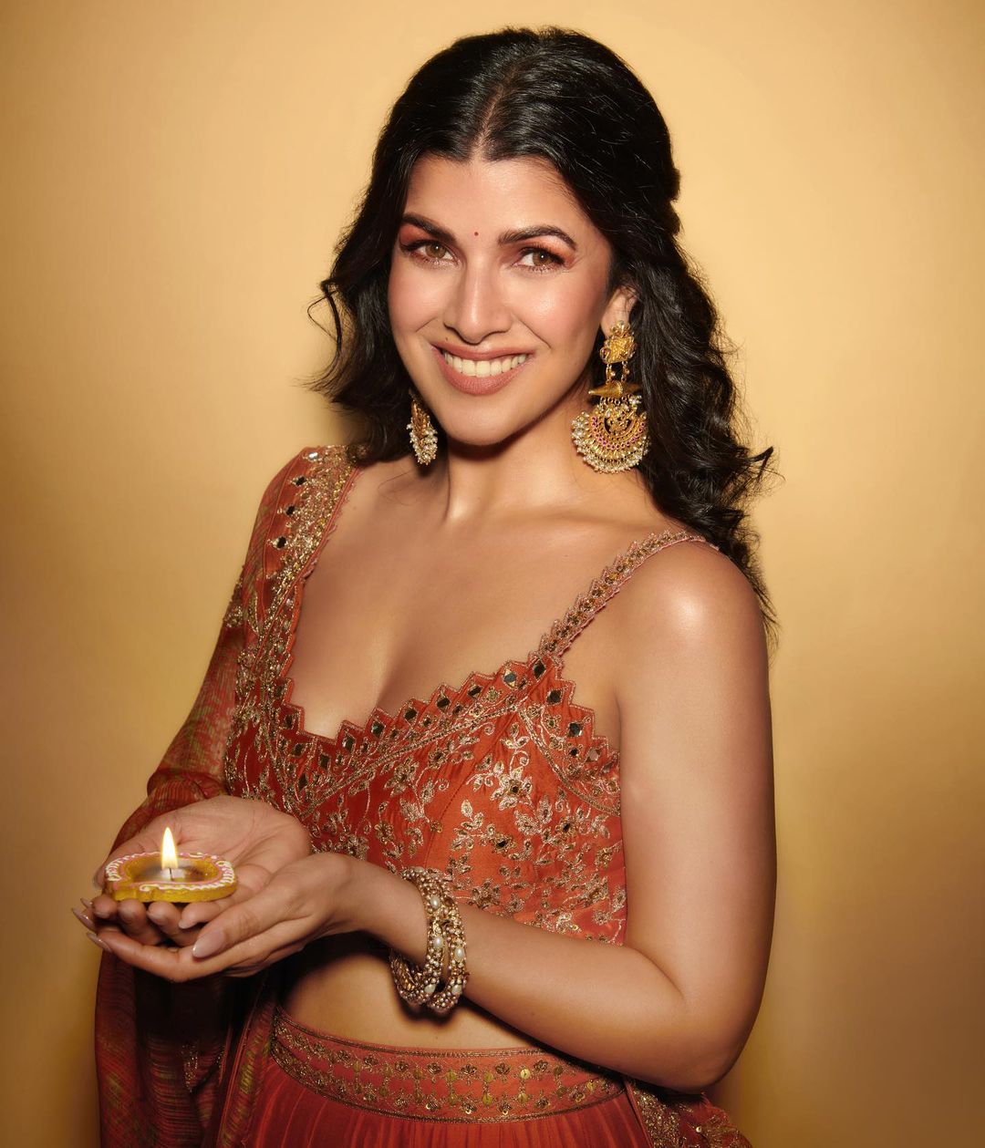 Bollywood Actress Nimrat Kaur Stills In Orange Lehenga Choli